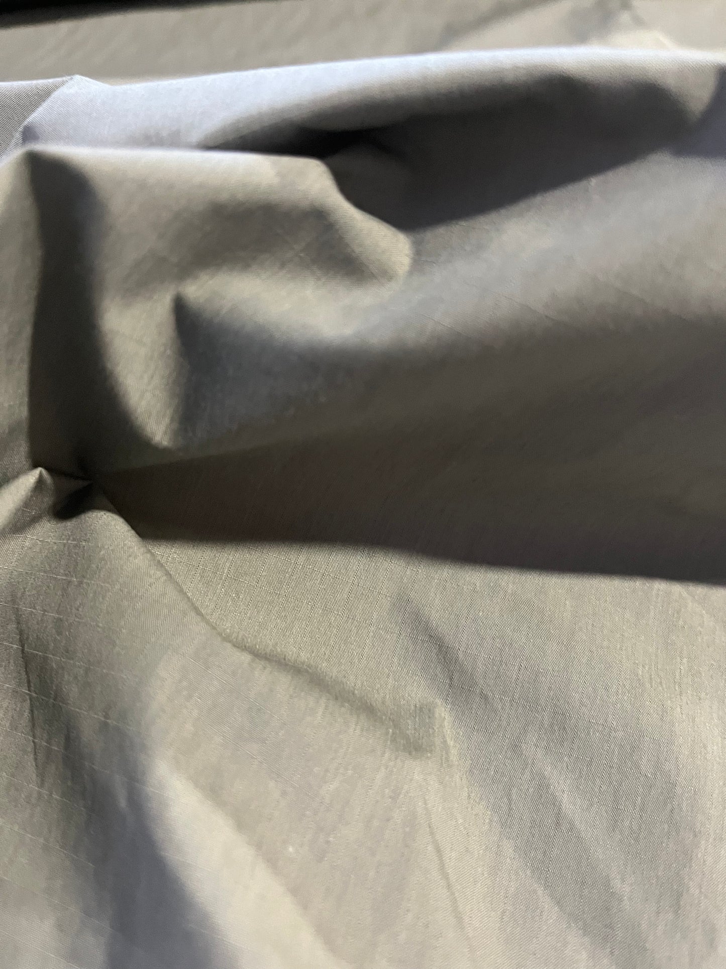 BASILE 045 coated cotton ribstop papertouch grey/green