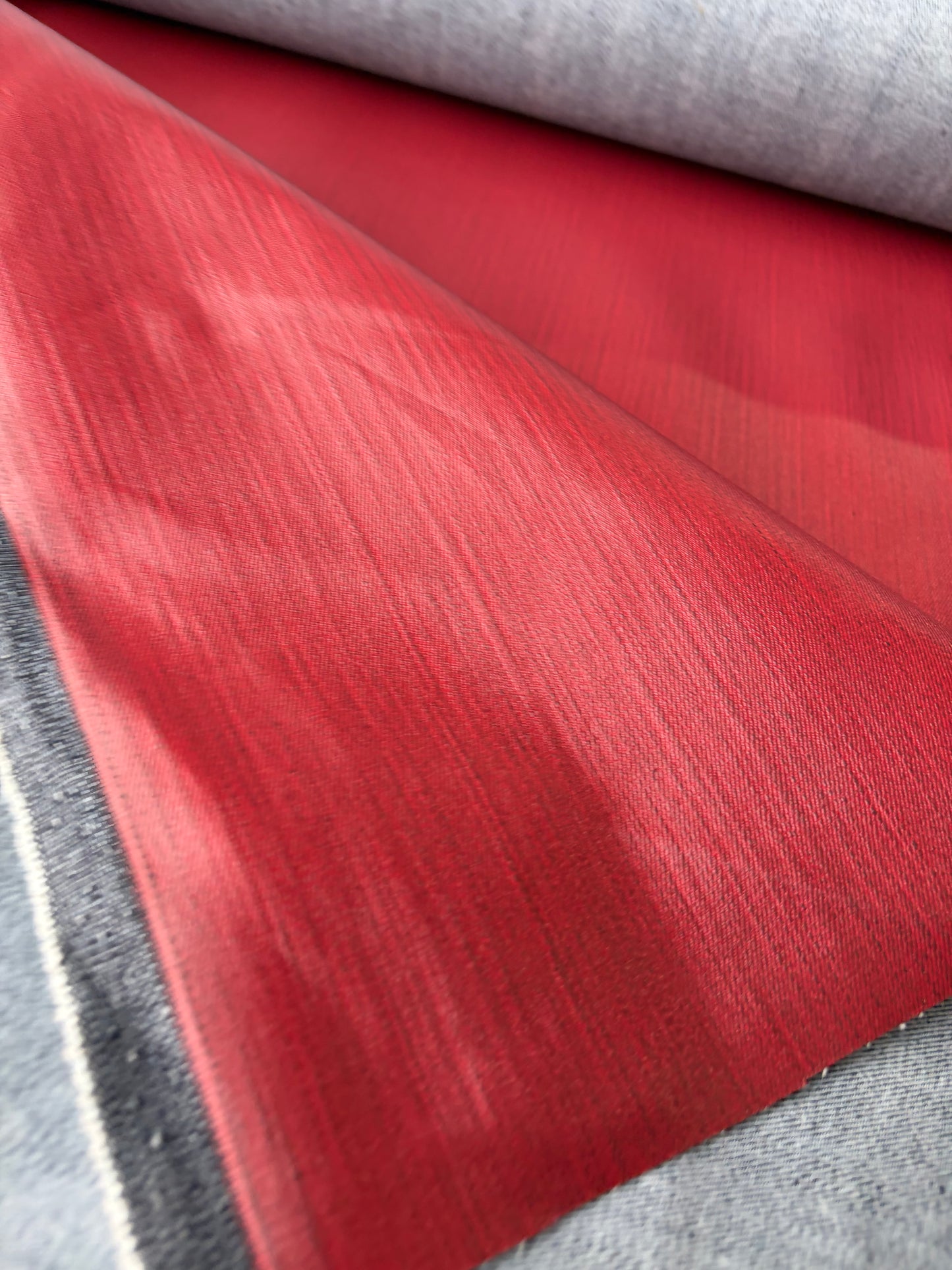 DENIM DROP denim with red coloured coating