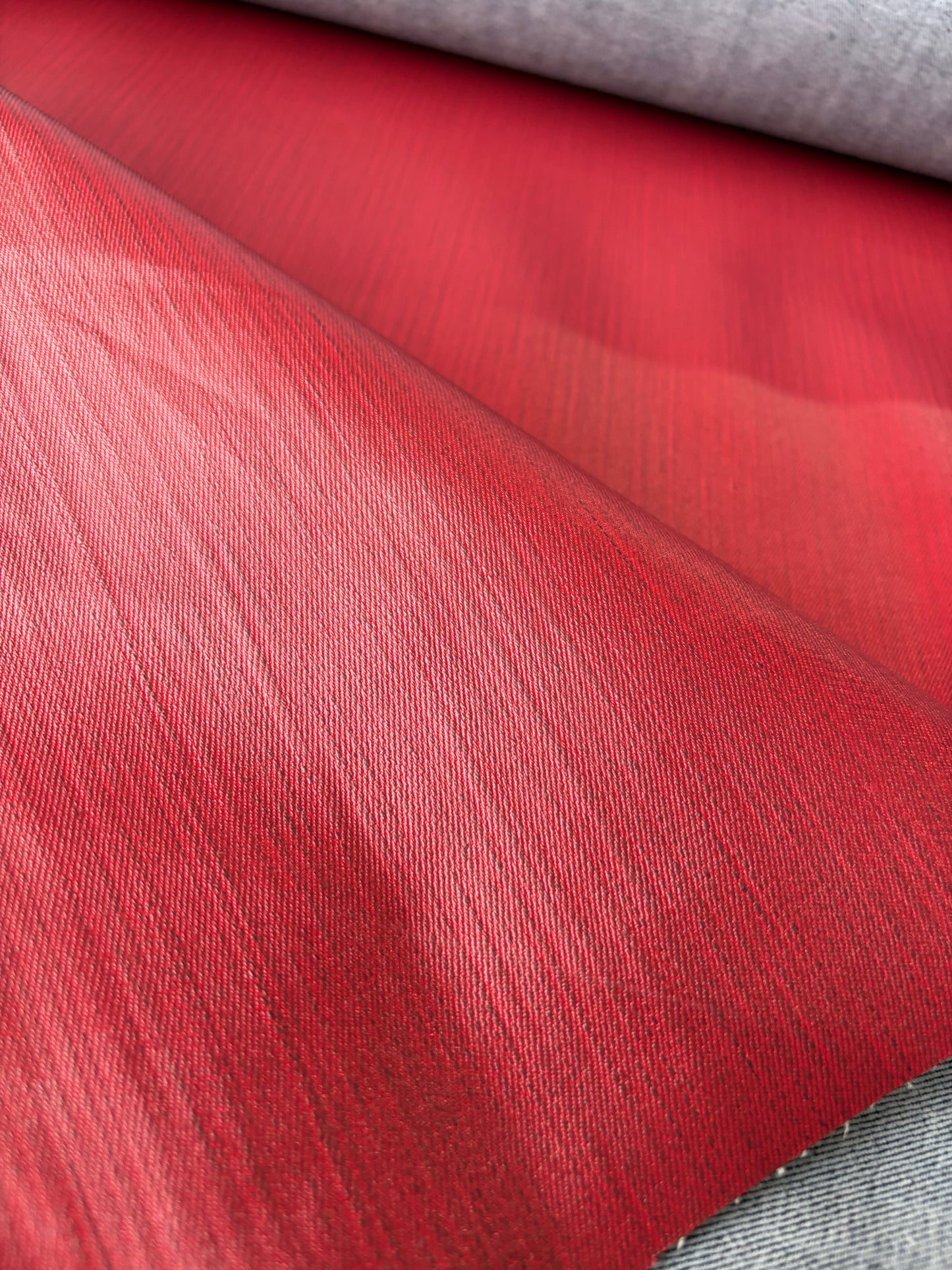 DENIM DROP denim with red coloured coating