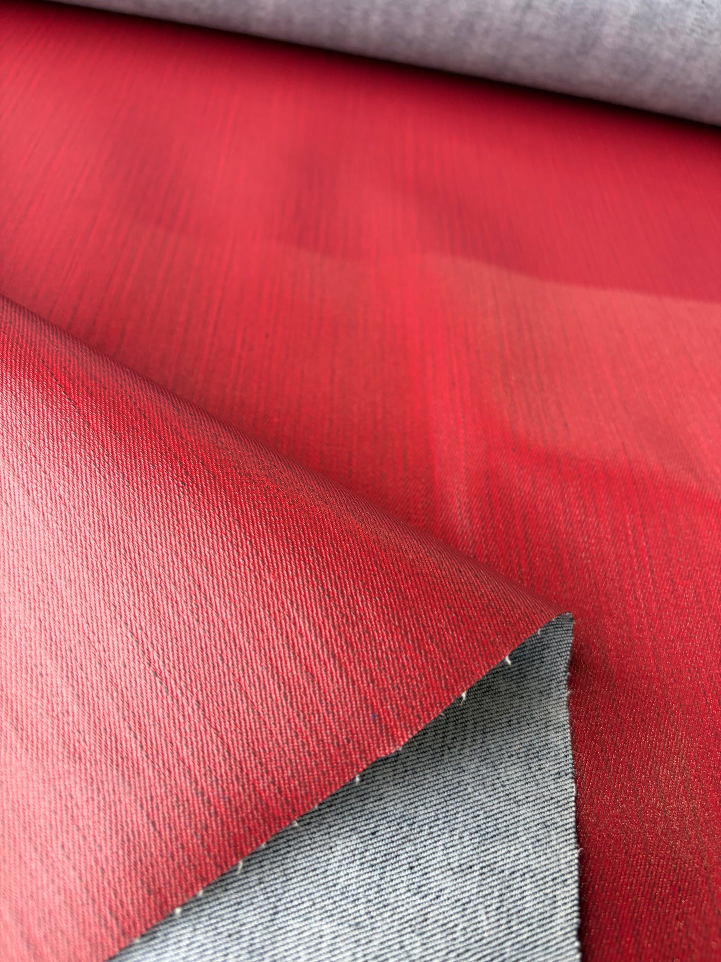 DENIM DROP denim with red coloured coating