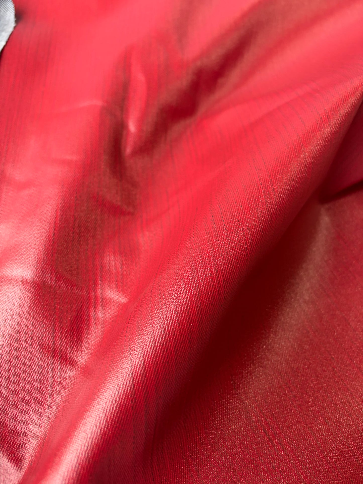 DENIM DROP denim with red coloured coating