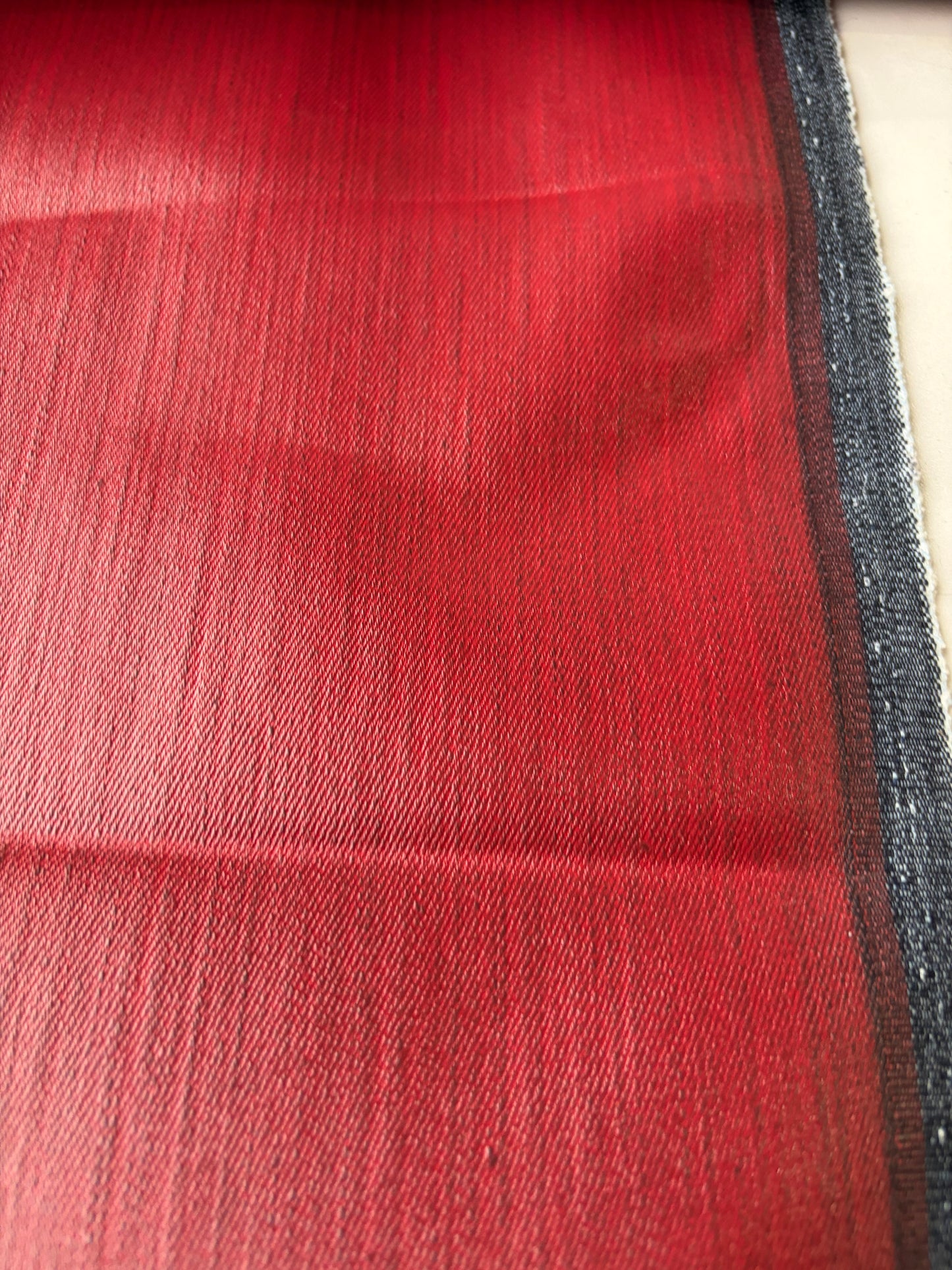 DENIM DROP denim with red coloured coating