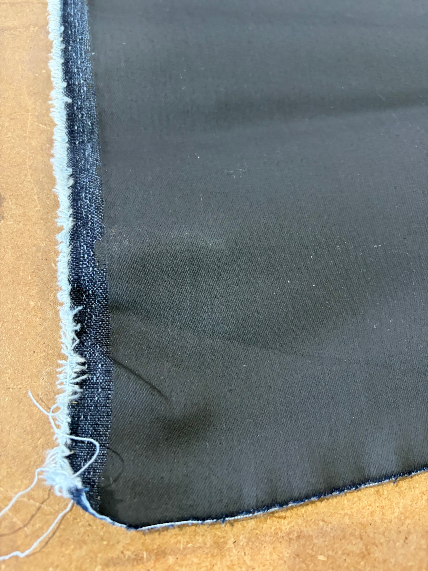 RAW DENIM 001 black coloured coated stretch denim